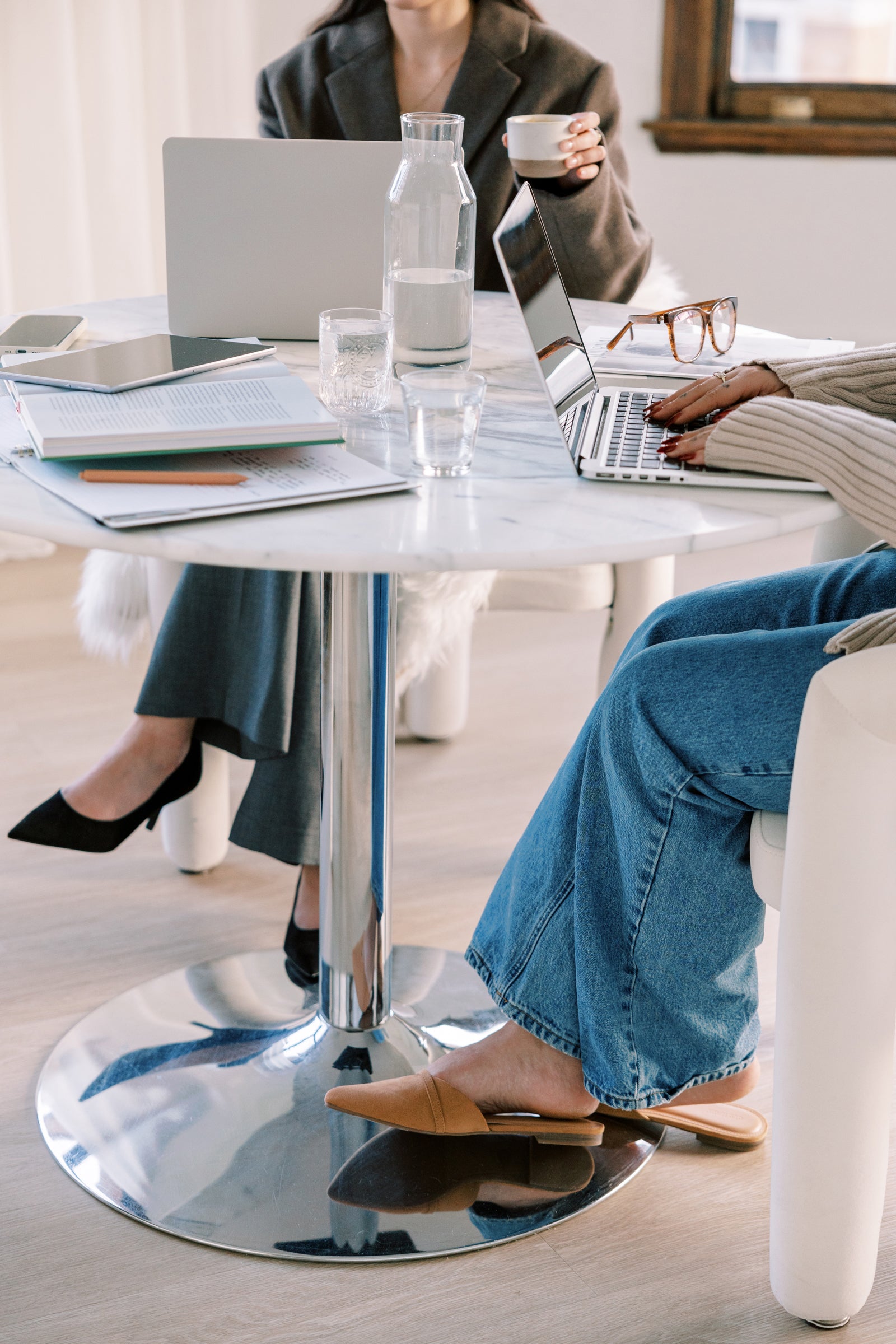 Pair of attorney's getting together to creative contracts and legal templates for creative entrepreneurs and service providers.