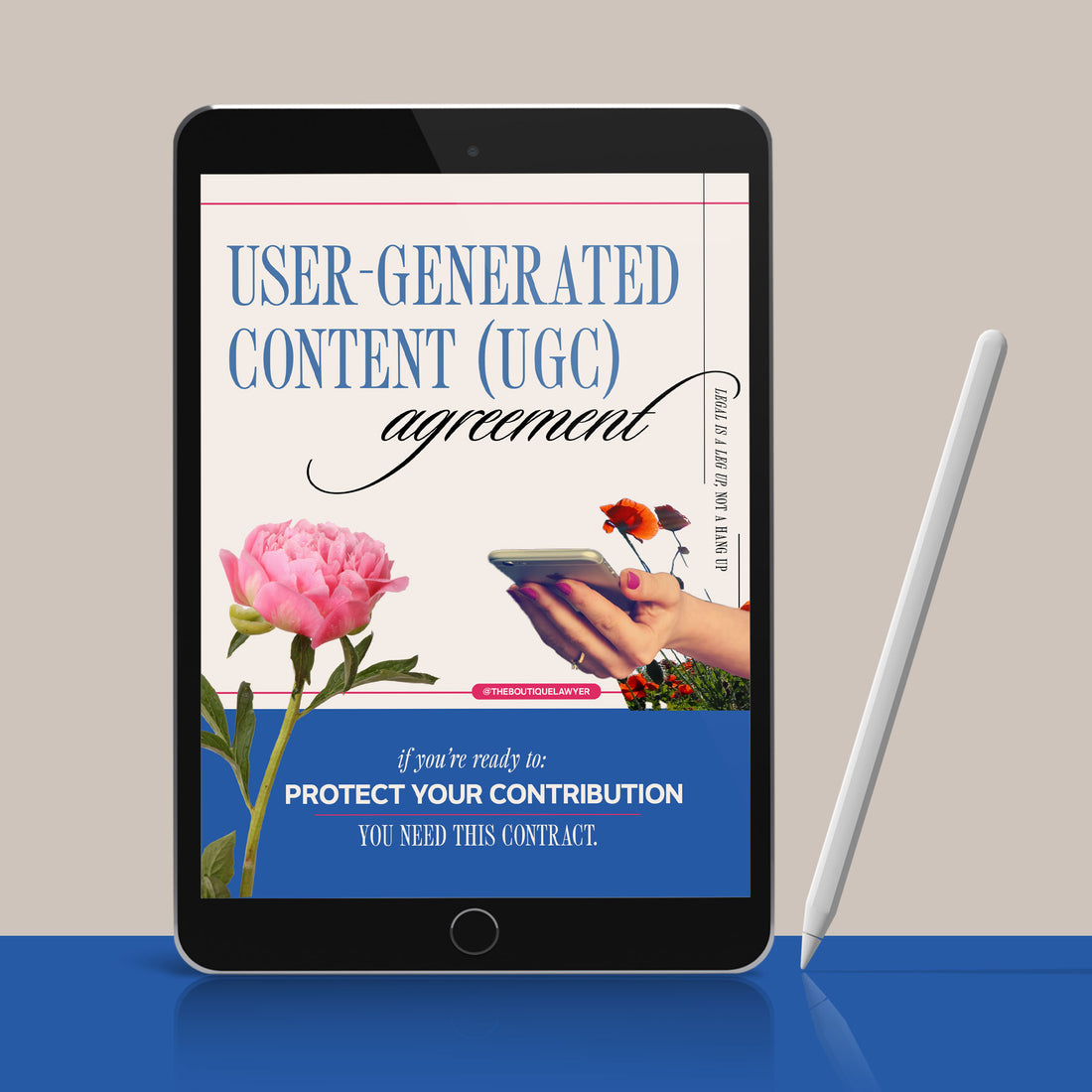 Digital tablet displaying a &quot;User-Generated Content agreement&quot; with poppies and a hand holding a phone, stylus beside it.