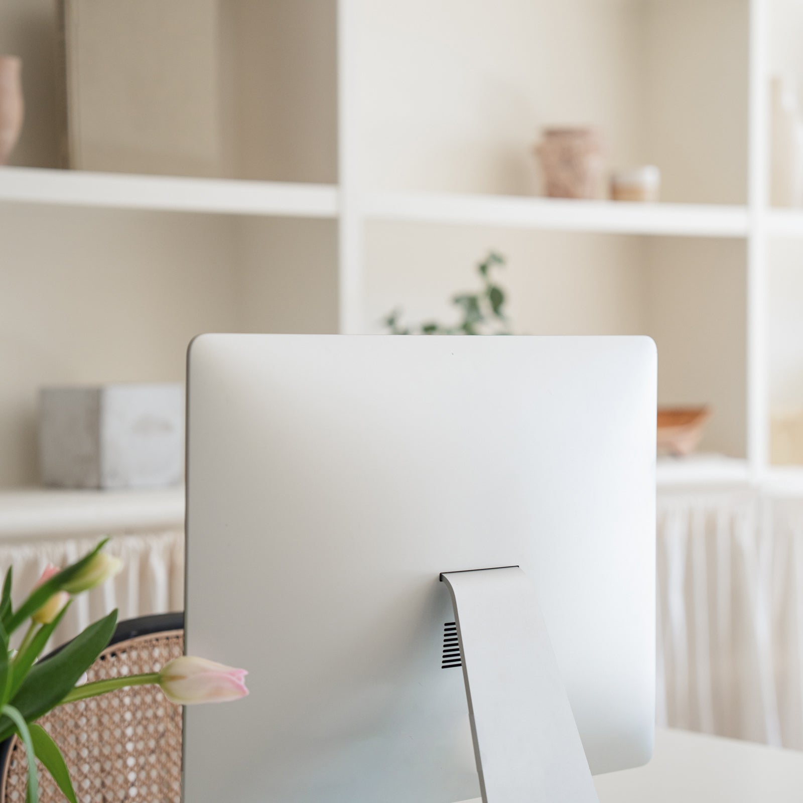Mac pro sitting on a light white desktop in a neutral designed office of an attorney for service providers and creative entrepreneurs.