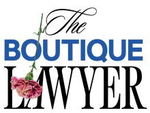 Logo of "The Boutique Lawyer" with a cursive "The" and bold letters for "BOUTIQUE LAWYER," decorated with a pink carnation flower.