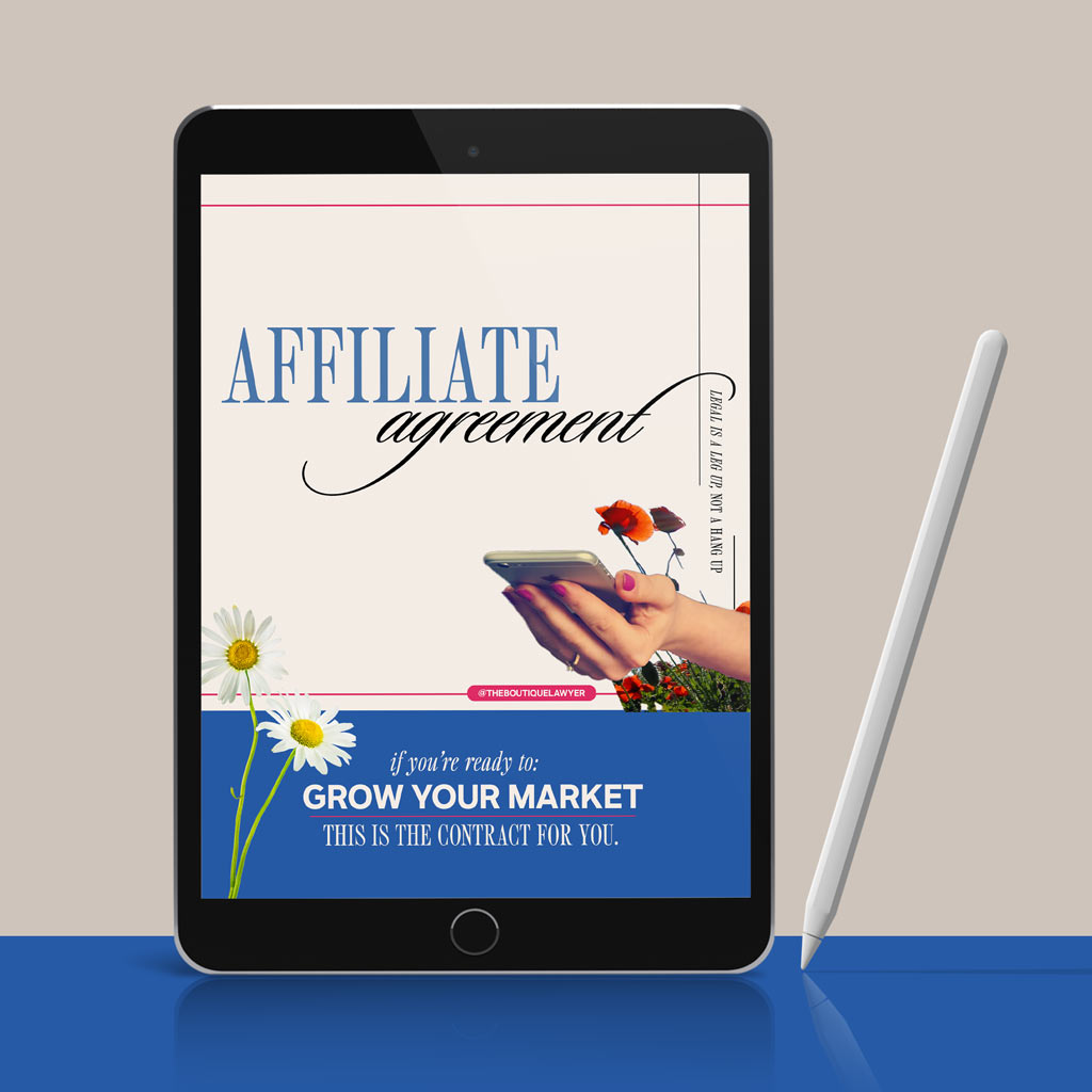 Digital tablet displaying a &quot;Affiliate agreement&quot; with flower and a hand holding a phone, stylus beside it.