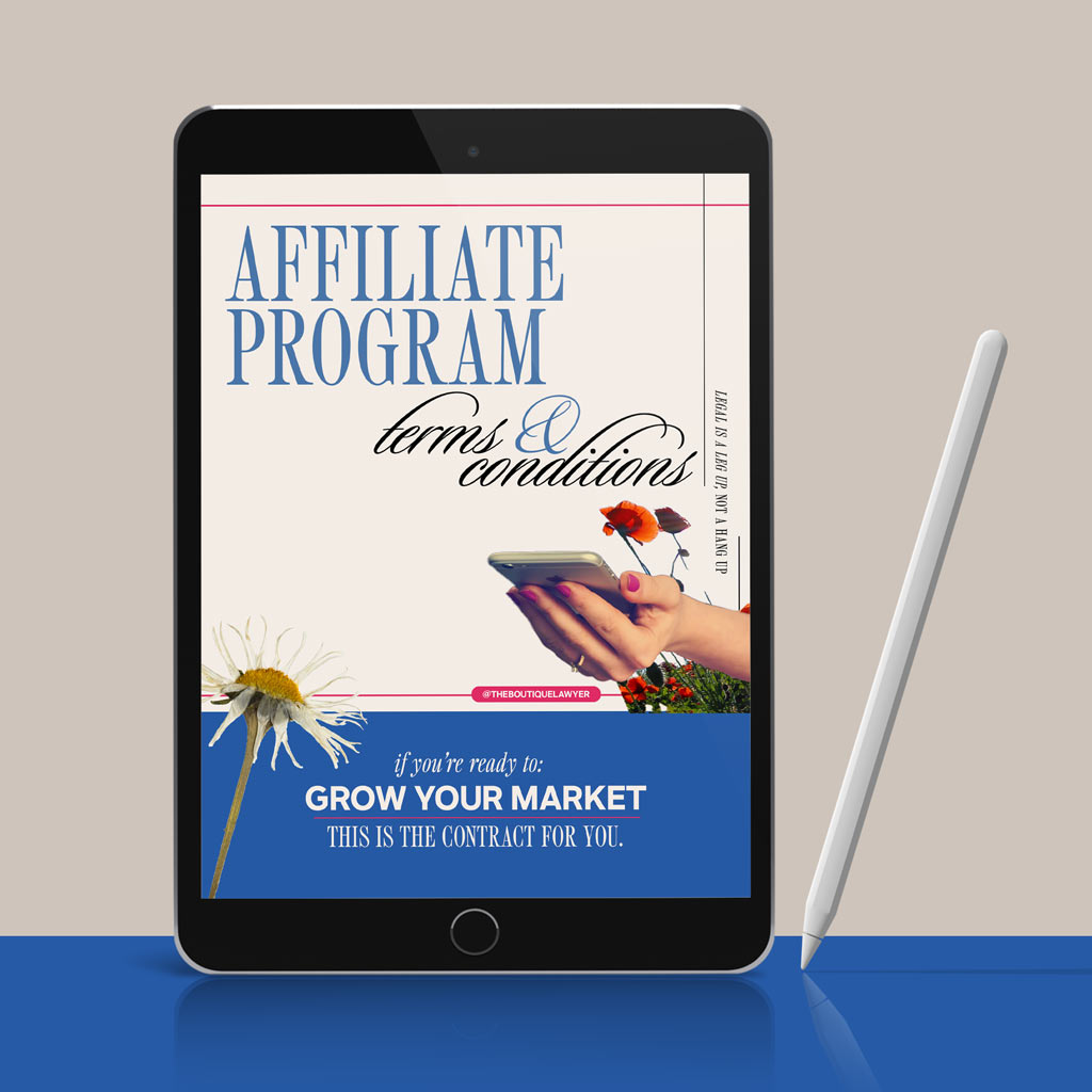 Digital tablet displaying a &quot;Affiliate Program terms &amp; conditions&quot; with flower and a hand holding a phone, stylus beside it.