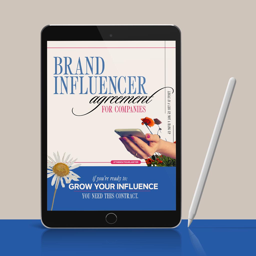 Digital tablet displaying a "Brand Influencer agreement for companies" with flower and a hand holding a phone, stylus beside it.