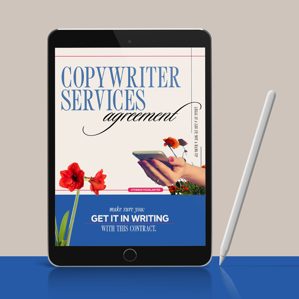 Digital tablet displaying a &quot;Copywriter Services agreement&quot; with flower and a hand holding a phone, stylus beside it.