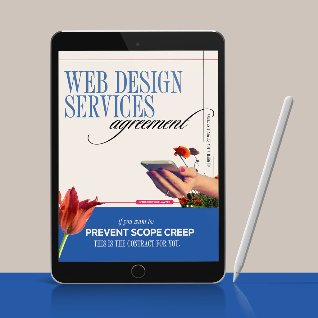 Digital tablet displaying a &quot;Web Design Services agreement&quot; with flower and a hand holding a phone, stylus beside it.